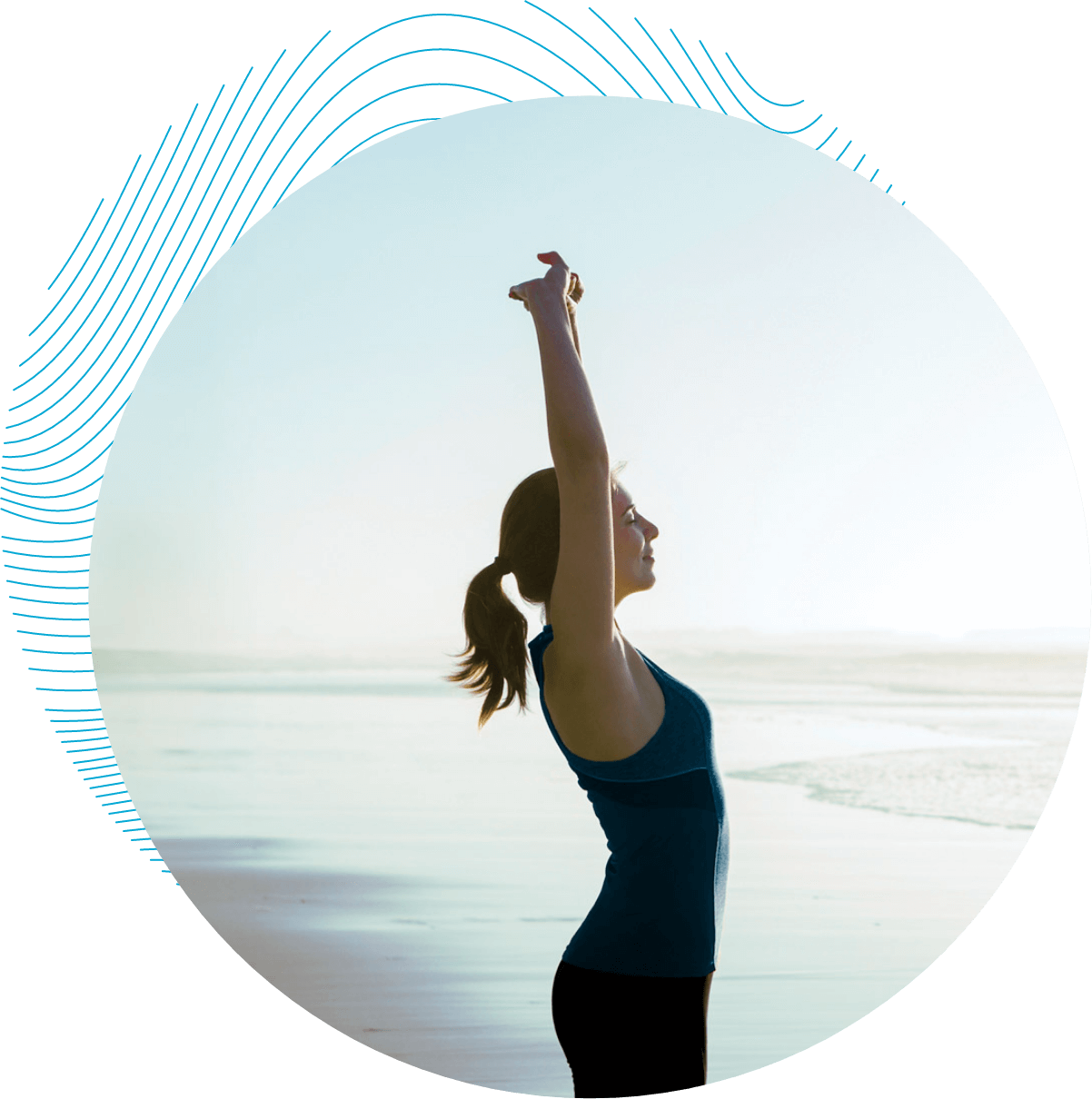 Shoot of a beautiful woman making stretching exercises in the beach.